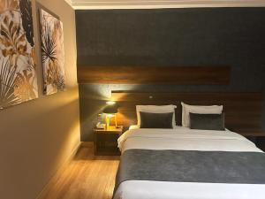 Postel nebo postele na pokoji v ubytování Yto boutique Hotel