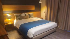 Postel nebo postele na pokoji v ubytování Yto boutique Hotel