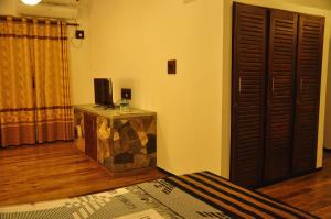 TV a/nebo společenská místnost v ubytování Asantha Guest House