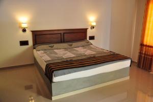Postel nebo postele na pokoji v ubytování Asantha Guest House