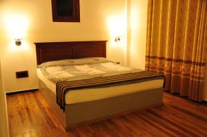 Postel nebo postele na pokoji v ubytování Asantha Guest House