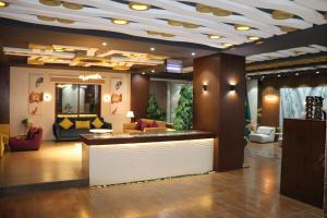 a lobby with a reception desk in a building at Yanbu Inn Residential Suites in Yanbu