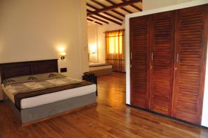 Postel nebo postele na pokoji v ubytování Asantha Guest House