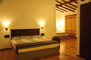 Postel nebo postele na pokoji v ubytování Asantha Guest House