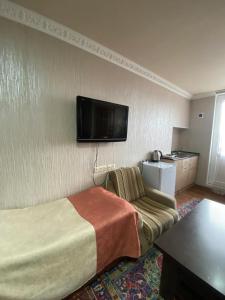 TV a/nebo společenská místnost v ubytování Madoyan Guest house
