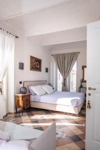 מיטה או מיטות בחדר ב-Casa Verrua