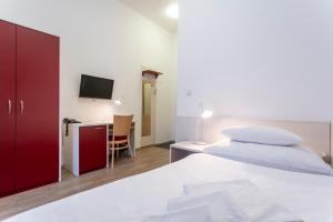 A bed or beds in a room at Apartmánový komplex Dagmar