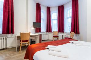 A bed or beds in a room at Apartmánový komplex Dagmar