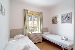 Postel nebo postele na pokoji v ubytování Tamango Hill Alcazaba B Casasol