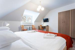 A bed or beds in a room at Apartmánový komplex Dagmar