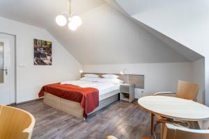 A bed or beds in a room at Apartmánový komplex Dagmar