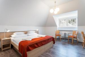 A bed or beds in a room at Apartmánový komplex Dagmar