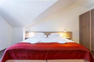 A bed or beds in a room at Apartmánový komplex Dagmar
