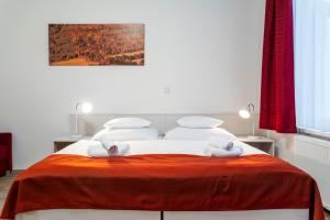 A bed or beds in a room at Apartmánový komplex Dagmar