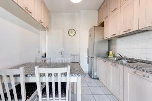 A kitchen or kitchenette at A Casa di Sara 3