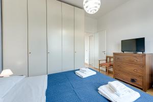 A bed or beds in a room at A Casa di Sara 3