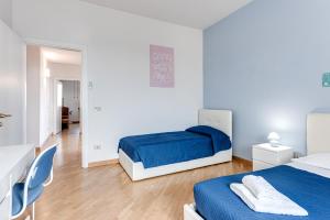 A bed or beds in a room at A Casa di Sara 3