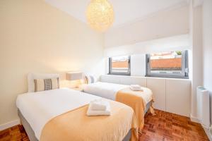 מיטה או מיטות בחדר ב-GuestReady - Riverfront modern living
