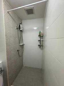 a bathroom with a shower with a toilet and a sink at Near central westgate at bangyai 80 in Ban Bang Krabu