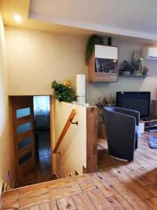 Televízia a/alebo spoločenská miestnosť v ubytovaní Apartament Aldi