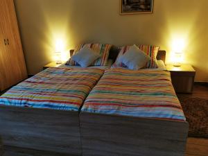 Posteľ alebo postele v izbe v ubytovaní Apartament Aldi