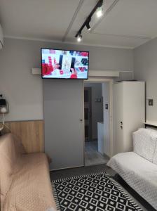 a living room with a flat screen tv on the wall at BR sc NR2-całe mieszkanie in Szczecinek