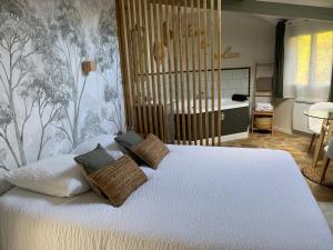 Postelja oz. postelje v sobi nastanitve Le Domaine du Sillon