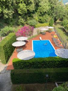 an overhead view of a swimming pool with umbrellas at Il Casalino in Maratea