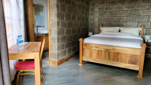 Postel nebo postele na pokoji v ubytování Babylon Lodge