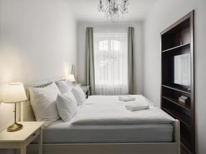 Postel nebo postele na pokoji v ubytování IMPERIAL Apartments