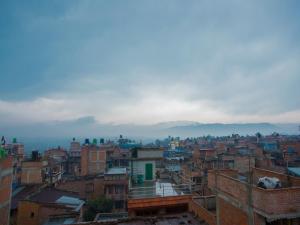 a view of a city with mountains in the background at Sweet Inn in Bhaktapur