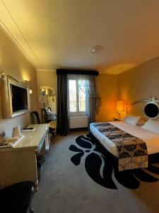 A bed or beds in a room at Zanhotel Tre Vecchi