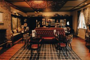 a living room with a couch and a chair at The Bull and Townhouse, Beaumaris- The Inn Collection Group in Beaumaris