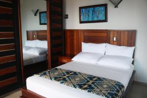 Postel nebo postele na pokoji v ubytování La Bocana de Quiximies Hotel