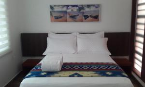 Postel nebo postele na pokoji v ubytování La Bocana de Quiximies Hotel