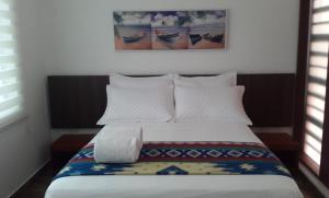Postel nebo postele na pokoji v ubytování La Bocana de Quiximies Hotel