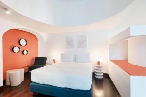 Säng eller sängar i ett rum på RELSTAY - Montenapoleone Suite