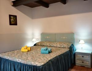 מיטה או מיטות בחדר ב-Agriturismo Al Castagno