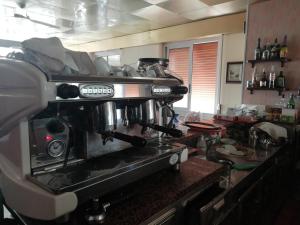 a coffee machine sitting on a counter in a kitchen at HOTEL GIORDANA in Loano +30 photos