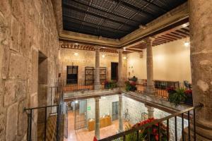 an indoor swimming pool in a building at OYO Hostal Mich in Morelia