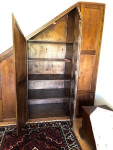 an old wooden cabinet with a drawer in a room at Casa vacanze Borgo Rondini in Rocca di Cambio +6 photos