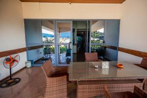 a dining room with a table and chairs at Beauty Hotel in Accra