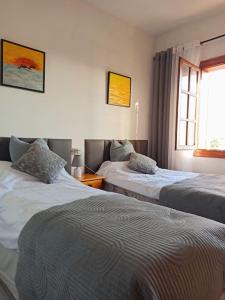 Postel nebo postele na pokoji v ubytování Azul del mar