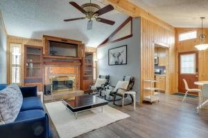 a living room with a blue couch and a fireplace at Round Rock Home with Large Yard 20 Mi to Austin! in Round Rock