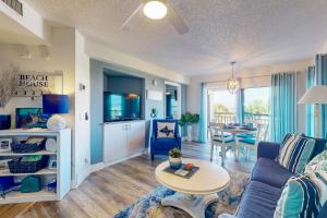 a living room with a couch and a table at Gulf Strand Resort 308 in St Pete Beach