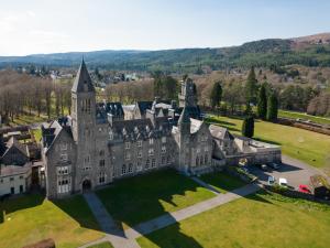 an aerial view of an old castle on a grass field at 2 Bed in Fort Augustus 80700 in Fort Augustus