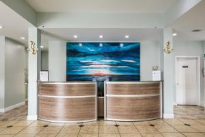 a lobby with a painting on the wall at Beachside Resort Hotel in Gulf Shores +19 photos