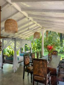 a dining room with a table and chairs at Medusa Bungalow - Galle in Galle