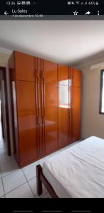 Giường trong phòng chung tại Guarapari Enseada Azul