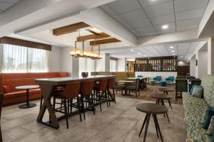 a lobby with a bar and tables and chairs at Hampton Inn Carefree, Az in Carefree